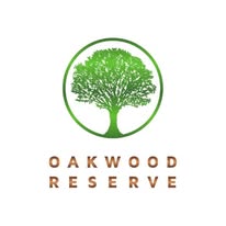 A logo with a tree and the words 